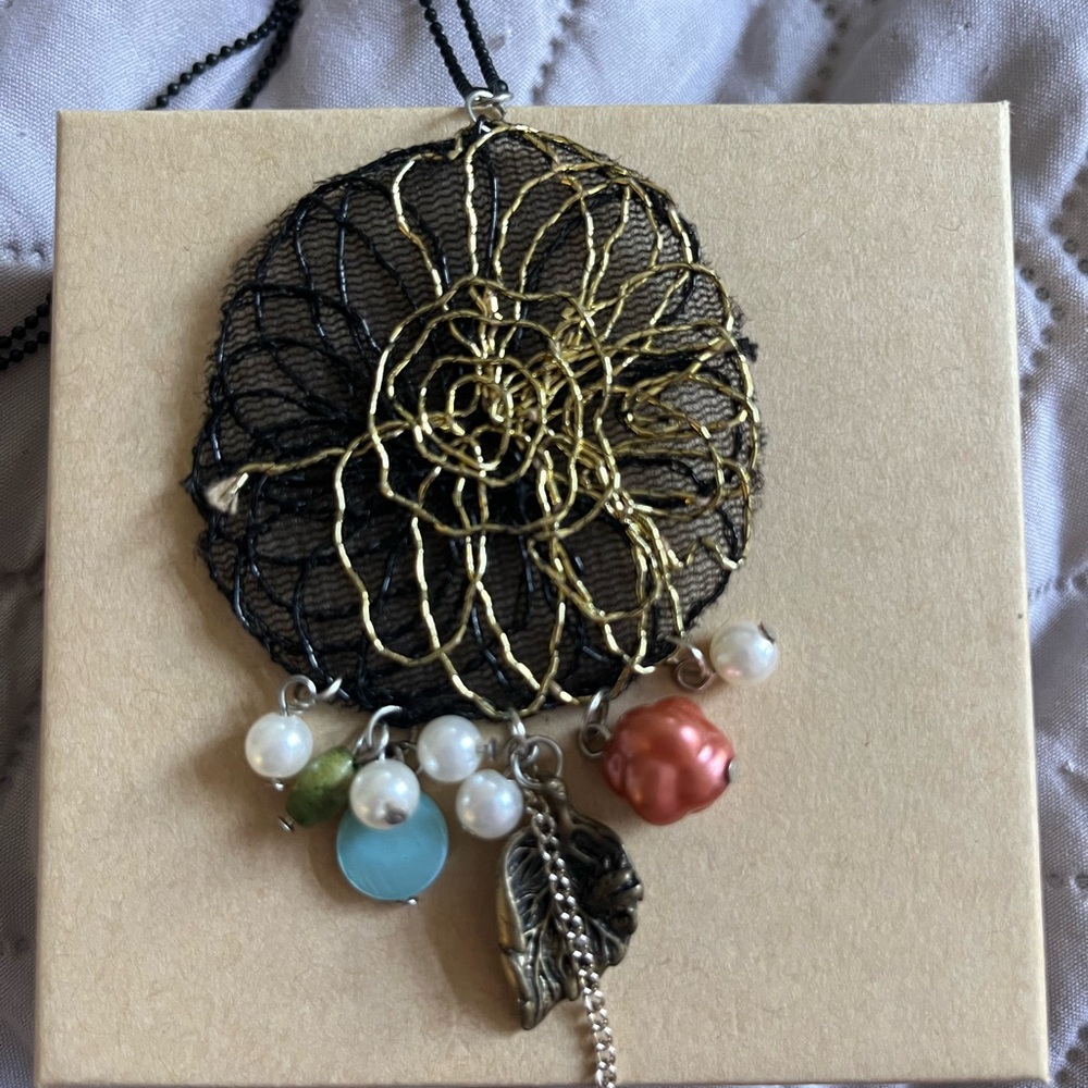 Black and Gold Wire Pendant Necklace with Charms